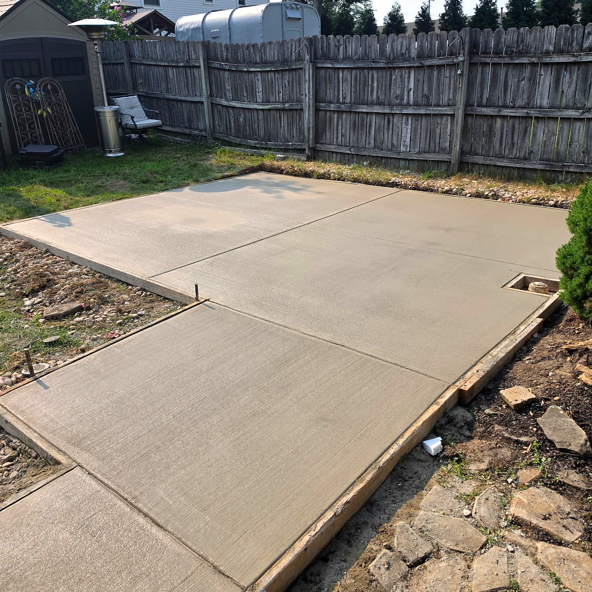 Freshly poured backyard concrete patio