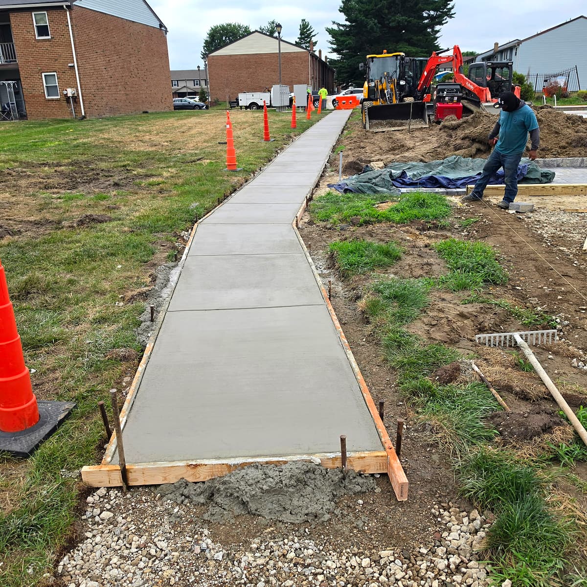 New concrete sidewalk being poured