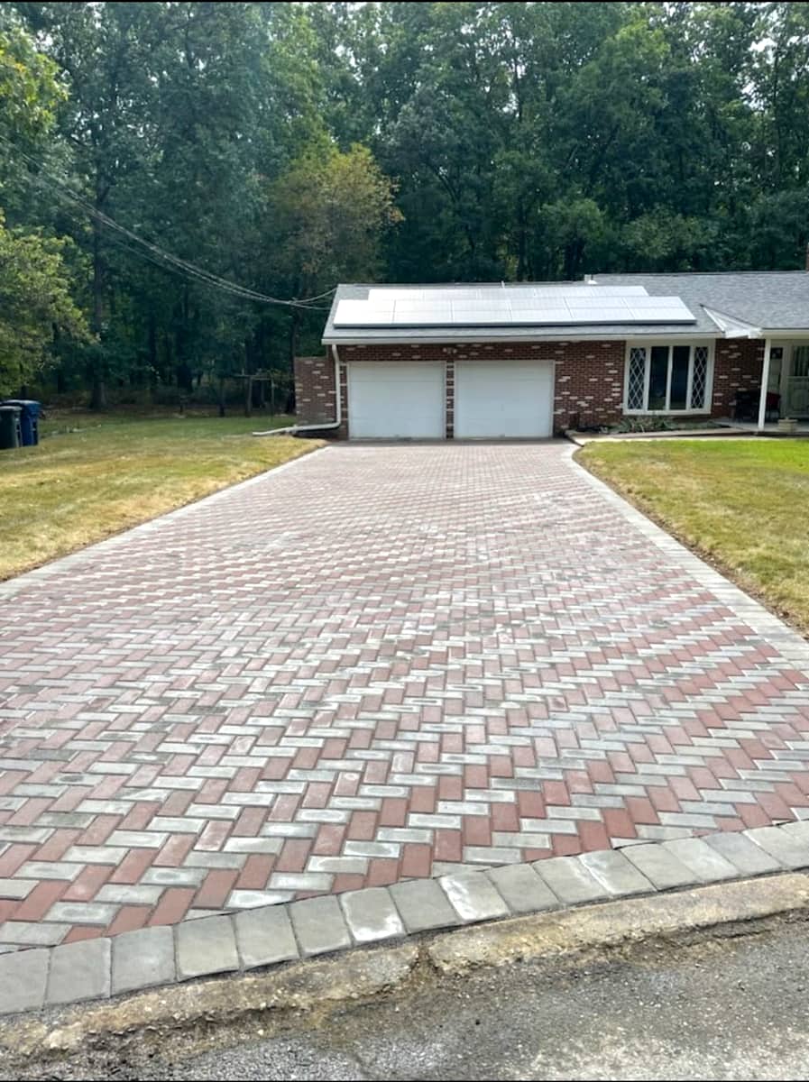Herringbone-pattern paver driveway
